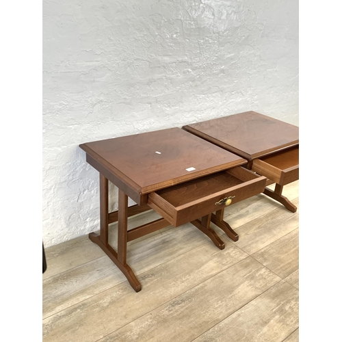 82 - A pair of stained mahogany bedside tables - approx. 52cm high x 57cm wide x 51cm deep