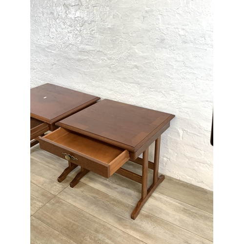 82 - A pair of stained mahogany bedside tables - approx. 52cm high x 57cm wide x 51cm deep