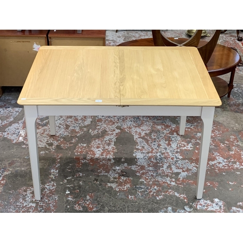 83 - An Arighi Bianchi oak and grey painted extending dining table - approx. 79cm high x 120cm long x 85c... 