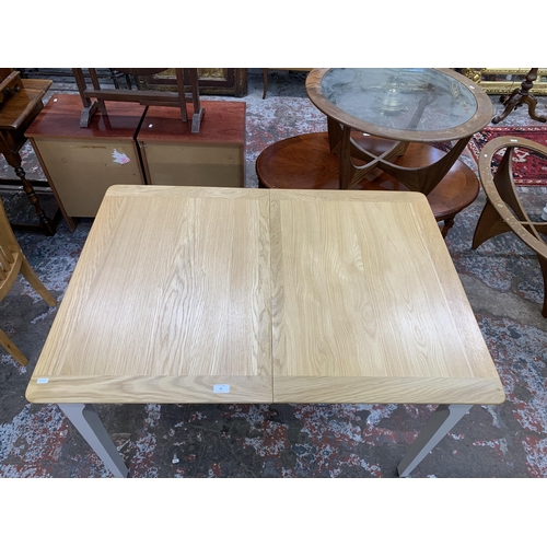 83 - An Arighi Bianchi oak and grey painted extending dining table - approx. 79cm high x 120cm long x 85c... 