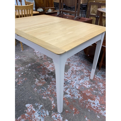 83 - An Arighi Bianchi oak and grey painted extending dining table - approx. 79cm high x 120cm long x 85c... 