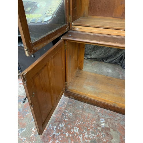 86 - A 19th century pitch pine bookcase - approx. 214cm high x 125cm wide x 52cm deep