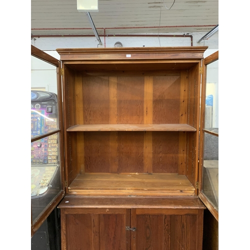 86 - A 19th century pitch pine bookcase - approx. 214cm high x 125cm wide x 52cm deep