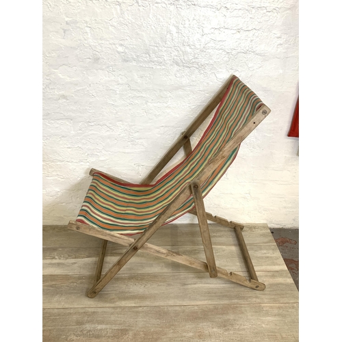 88 - Two mid 20th century beech framed sun loungers