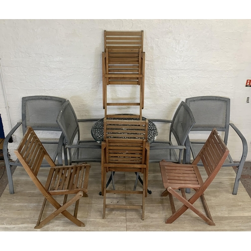 95 - Nine pieces of garden furniture comprising set of four grey metal stacking armchairs, set of four te... 