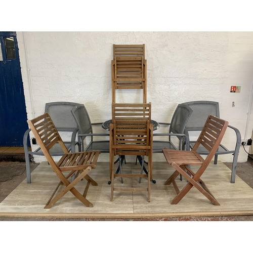 95 - Nine pieces of garden furniture comprising set of four grey metal stacking armchairs, set of four te... 