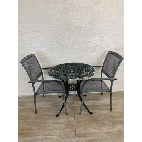 95 - Nine pieces of garden furniture comprising set of four grey metal stacking armchairs, set of four te... 