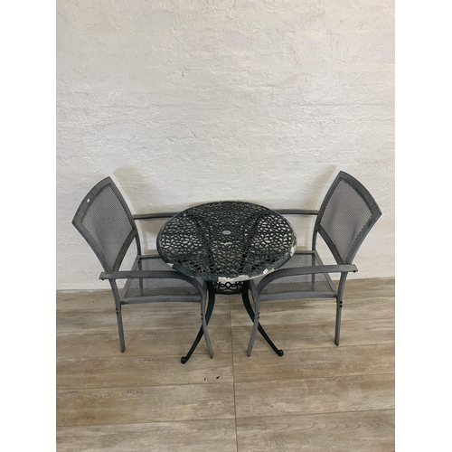 95 - Nine pieces of garden furniture comprising set of four grey metal stacking armchairs, set of four te... 