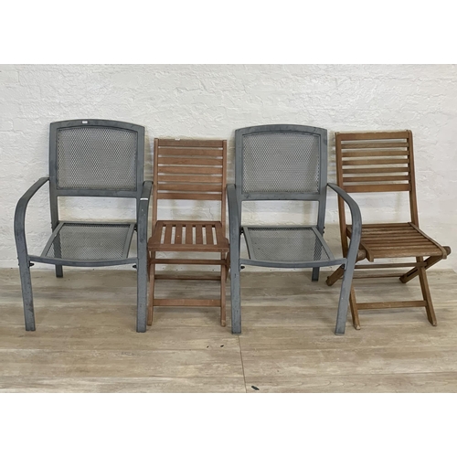 95 - Nine pieces of garden furniture comprising set of four grey metal stacking armchairs, set of four te... 