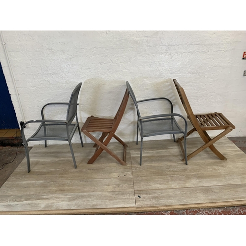 95 - Nine pieces of garden furniture comprising set of four grey metal stacking armchairs, set of four te... 