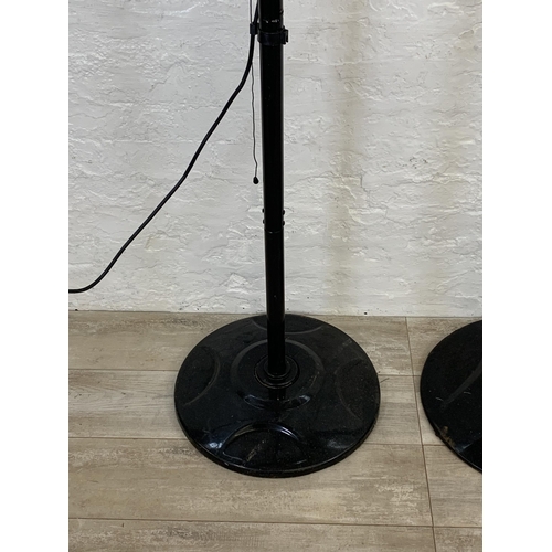 98 - Two black metal floor standing electric heaters