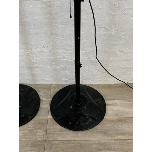 98 - Two black metal floor standing electric heaters