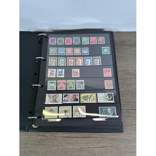 546 - Five albums containing a collection of worldwide stamps