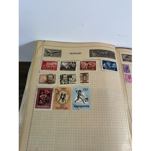 551 - Six albums containing a collection of worldwide stamps