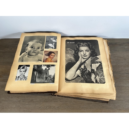 553 - A vintage scrapbook containing a collection of newspaper, magazine and book cuttings