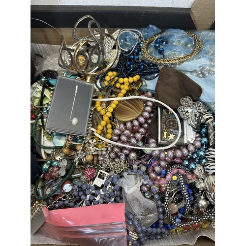 539 - A collection of costume jewellery to include earrings, necklaces, brooches, bangles etc.