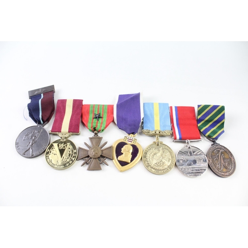 2316 - Seven military medals to include Purple Heart, Cold War, RAF Warma, Hong Kong Service, French etc.