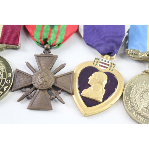 2316 - Seven military medals to include Purple Heart, Cold War, RAF Warma, Hong Kong Service, French etc.