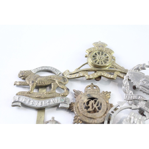 2317 - Ten military cap badges