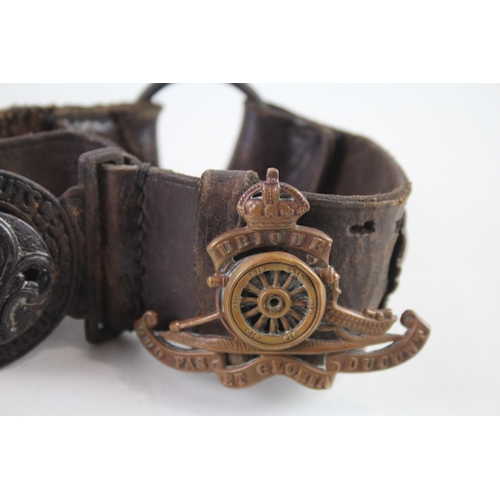 2319 - A vintage Boy Scouts brown leather Belt complete with badges to include military cap badges, His Mas... 