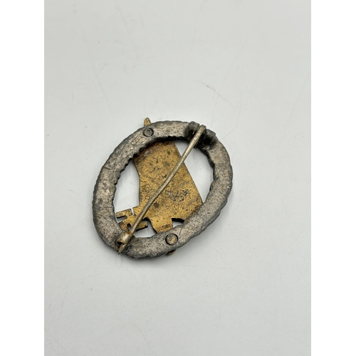 2323 - A reproduction German style paratroopers badge, marked 'Brehmer Berlin.3' to reverse