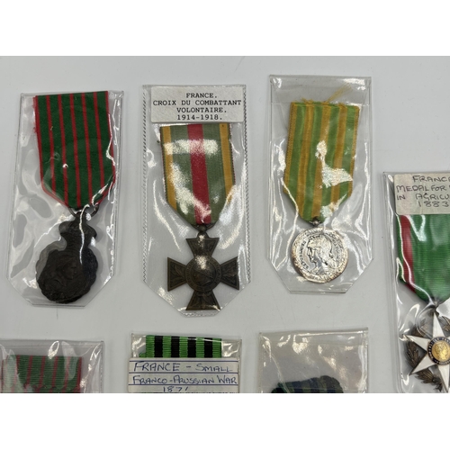 2336 - Seven French military medals to include Medal for Merit in Agriculture, St. Helena with bust of Napo... 