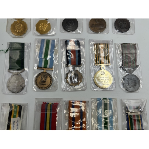 2340 - Fifteen South African military and police medals to include Good Service, Defence Force 20 Years Ser... 