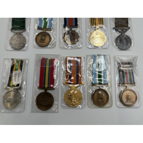 2340 - Fifteen South African military and police medals to include Good Service, Defence Force 20 Years Ser... 