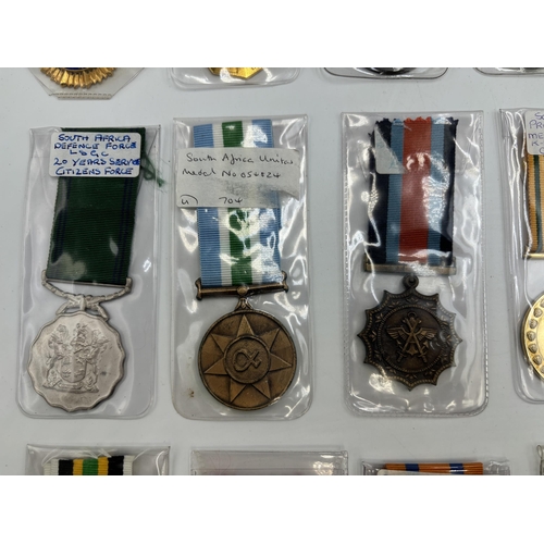 2340 - Fifteen South African military and police medals to include Good Service, Defence Force 20 Years Ser... 