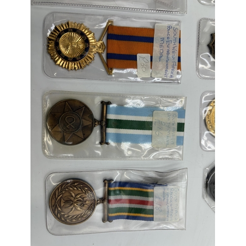 2340 - Fifteen South African military and police medals to include Good Service, Defence Force 20 Years Ser... 