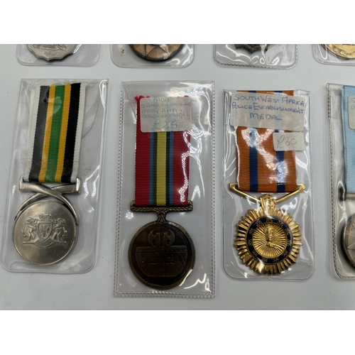 2340 - Fifteen South African military and police medals to include Good Service, Defence Force 20 Years Ser... 