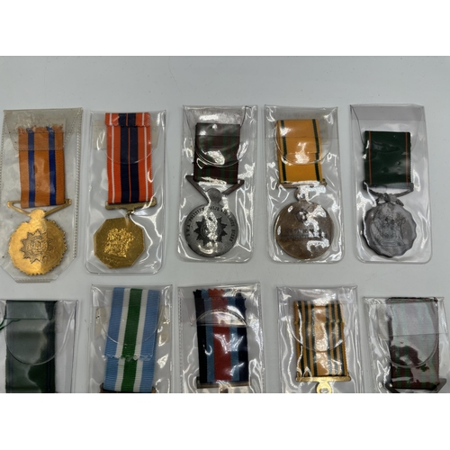 2340 - Fifteen South African military and police medals to include Good Service, Defence Force 20 Years Ser... 