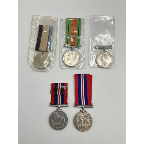 2355 - Five WWII British military medals, two Defence, two War and one Australian Service