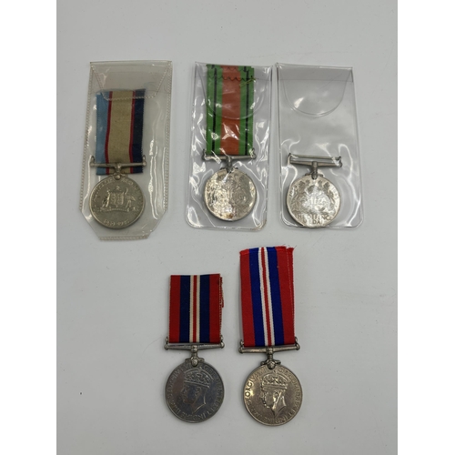 2355 - Five WWII British military medals, two Defence, two War and one Australian Service