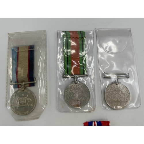 2355 - Five WWII British military medals, two Defence, two War and one Australian Service