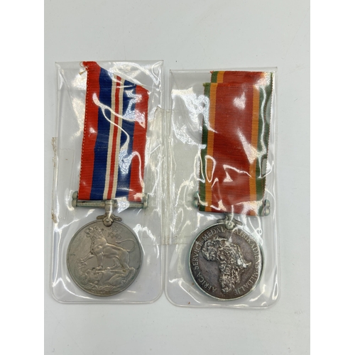 2358 - A WWII British military medal pair, one War and one Africa Service presented to 282273. H. J. Smith.