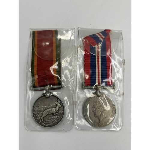 2358 - A WWII British military medal pair, one War and one Africa Service presented to 282273. H. J. Smith.