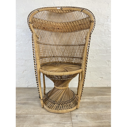 10 - A mid 20th century wicker peacock chair - approx. 110cm high x 71cm wide x 46cm deep