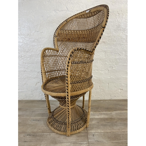 10 - A mid 20th century wicker peacock chair - approx. 110cm high x 71cm wide x 46cm deep