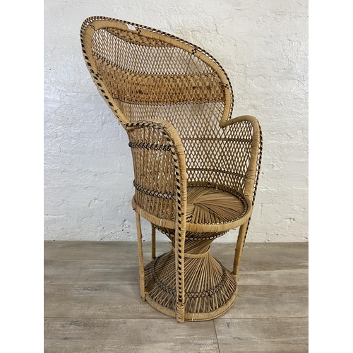 10 - A mid 20th century wicker peacock chair - approx. 110cm high x 71cm wide x 46cm deep