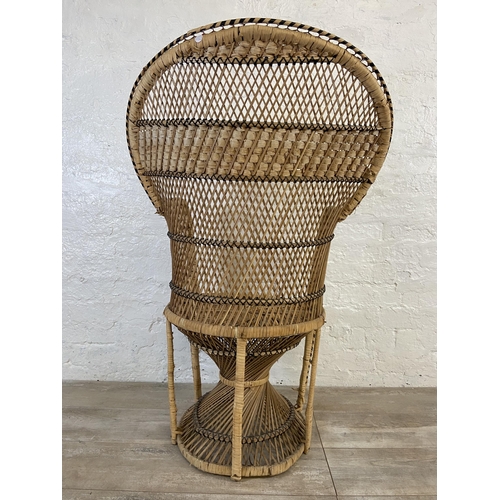 10 - A mid 20th century wicker peacock chair - approx. 110cm high x 71cm wide x 46cm deep