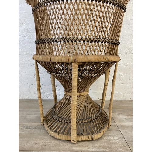 10 - A mid 20th century wicker peacock chair - approx. 110cm high x 71cm wide x 46cm deep