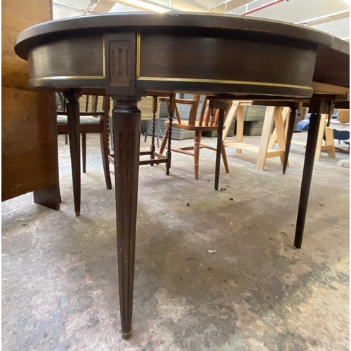 102 - A Regency style mahogany D end extending dining table on reeded supports - approx. 75cm high x 110cm... 