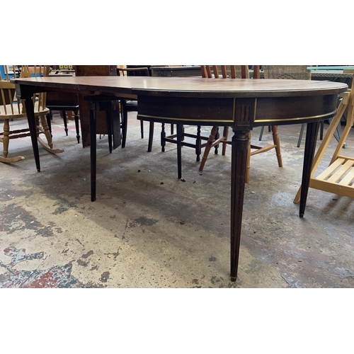 102 - A Regency style mahogany D end extending dining table on reeded supports - approx. 75cm high x 110cm... 