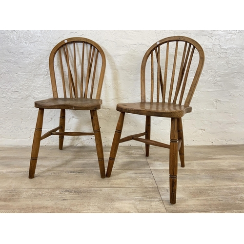 103 - A pair of early 20th century elm and beech Windsor dining chairs