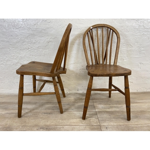 103 - A pair of early 20th century elm and beech Windsor dining chairs