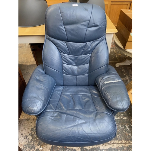 109 - A Stressless style blue leather swivel reclining armchair