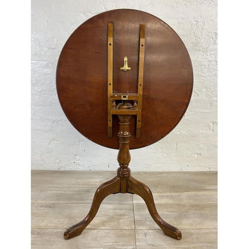 11 - A burr walnut and mahogany circular tilt top tripod pedestal occasional table with bird cage mechani... 