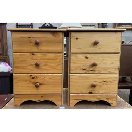 112 - A pair of pine bedside chests of drawers - approx. 61cm high x 44cm wide x 38cm deep