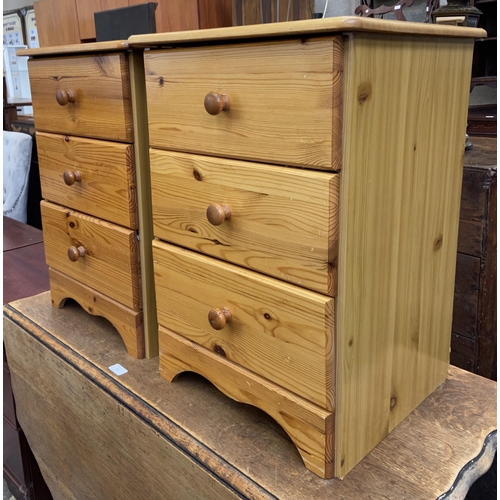 112 - A pair of pine bedside chests of drawers - approx. 61cm high x 44cm wide x 38cm deep